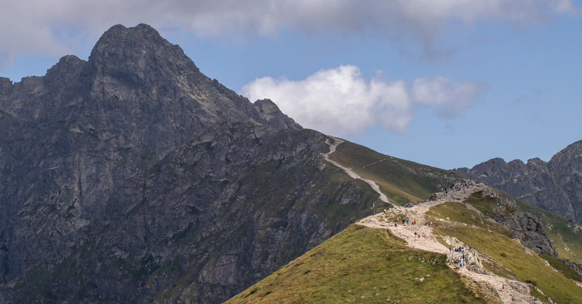 Scenic view of hikers on a trail in the Tatra Mountains, Zakopane.